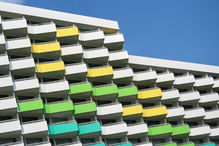 Balconie - white, green, and yellow painted building