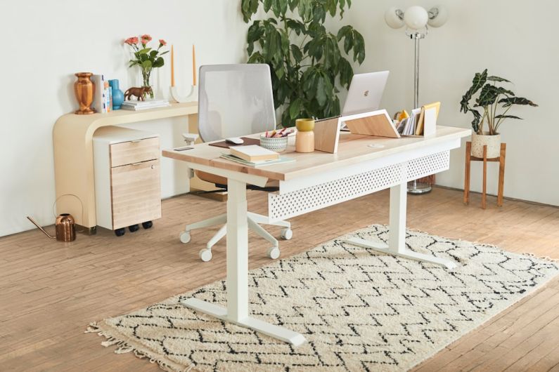 Home Office Desk - a white desk with a laptop on top of it