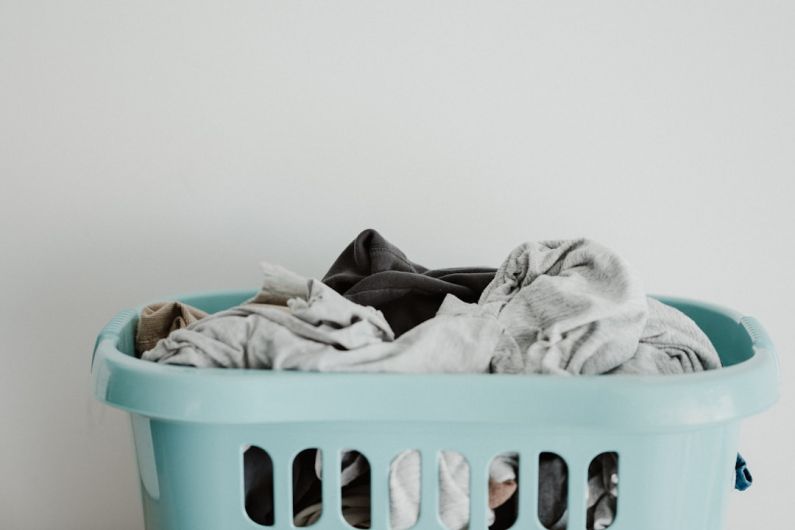 Laundry Room - white textile on blue plastic laundry basket