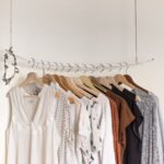 Laundry Room - assorted clothes in wooden hangers