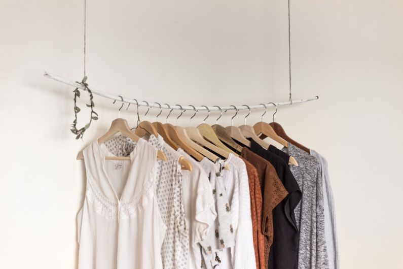 Laundry Room - assorted clothes in wooden hangers