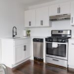 Kitchen Chairs - white wooden kitchen cabinet and white microwave oven